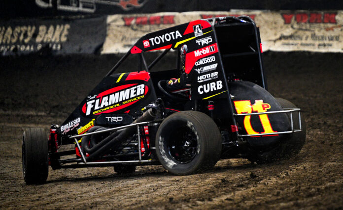 Sprint car racing on dirt track