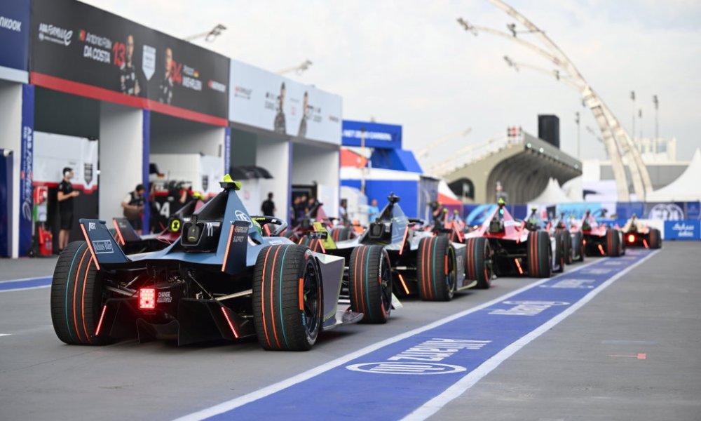 Row of IndyCar vehicles lined up