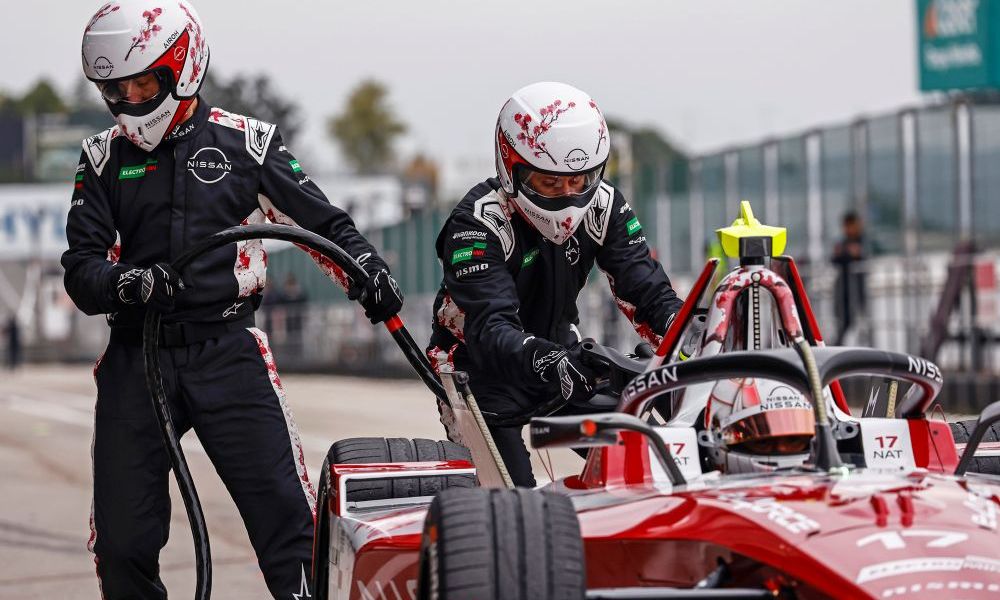 Race car pit stop crew working