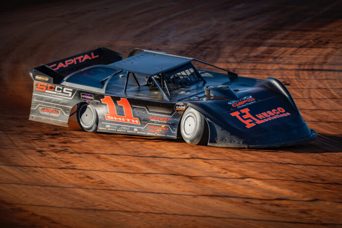 A dirt track race car racing