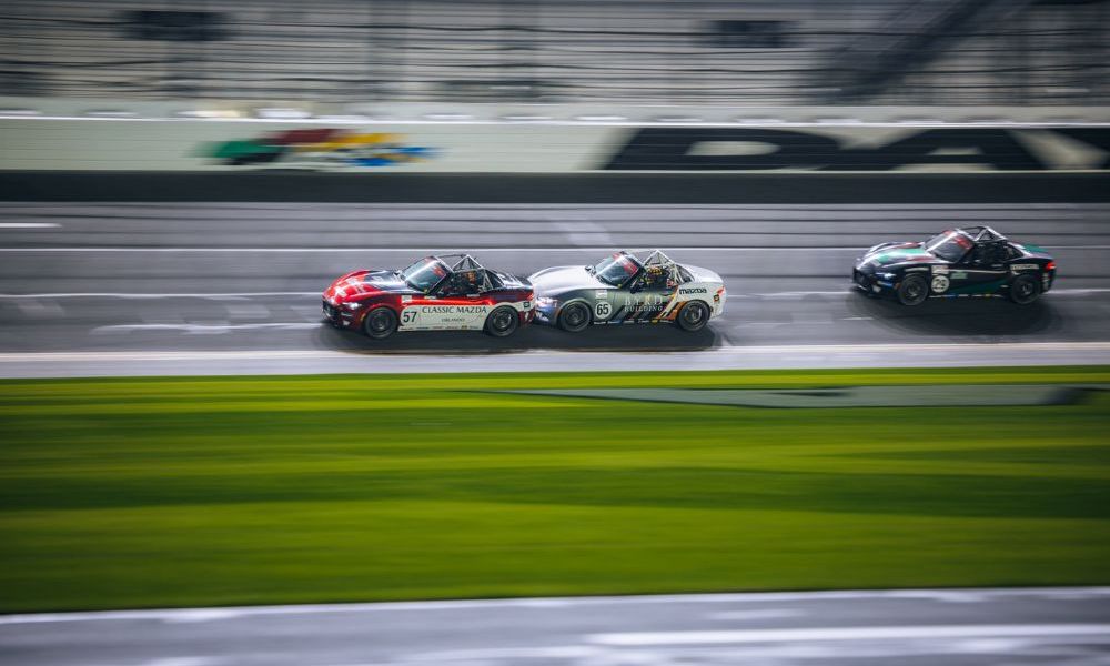 Blurred race cars at high speed