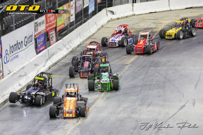 Sprint cars racing on dirt oval