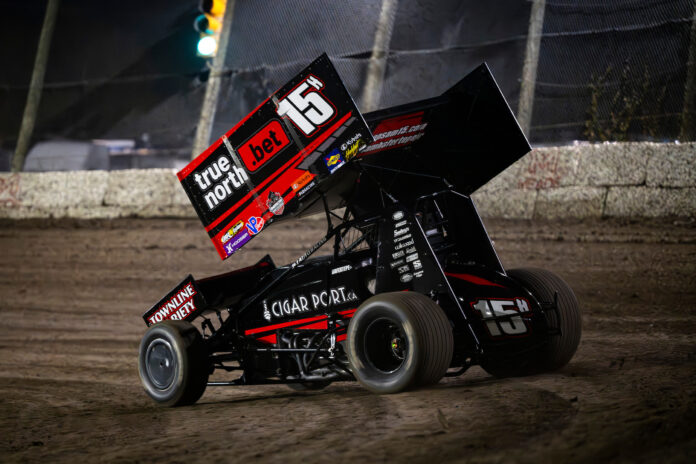 Sprint car racing on dirt track