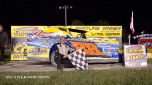 Flagman with checkered racing flag