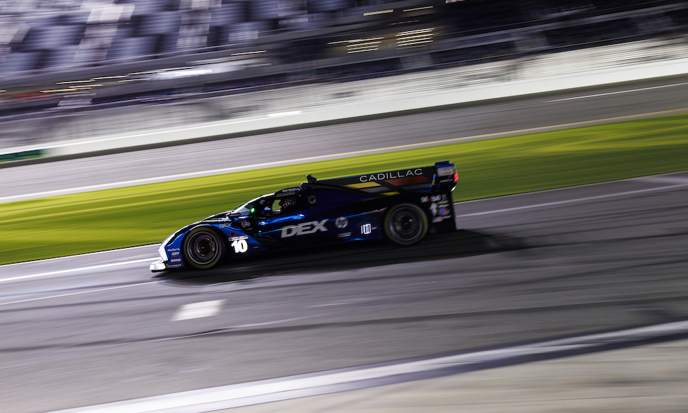 Blue race car speeding on track