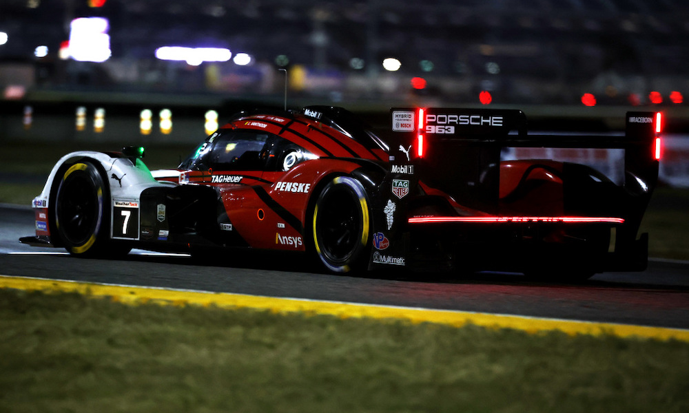 Red IndyCar race car at track