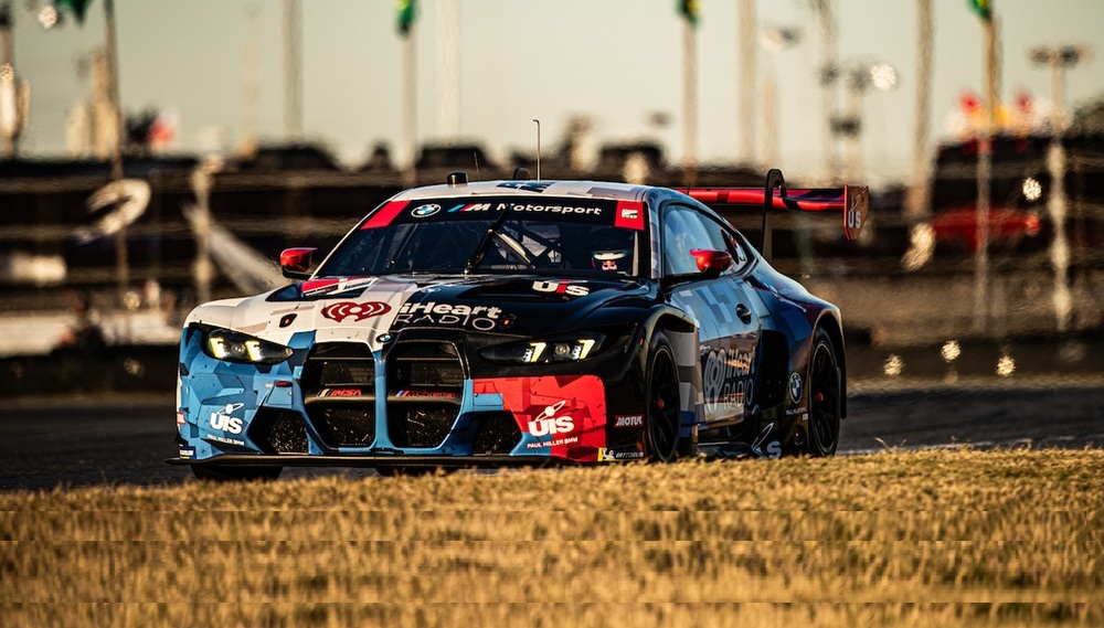 Red race car on racetrack