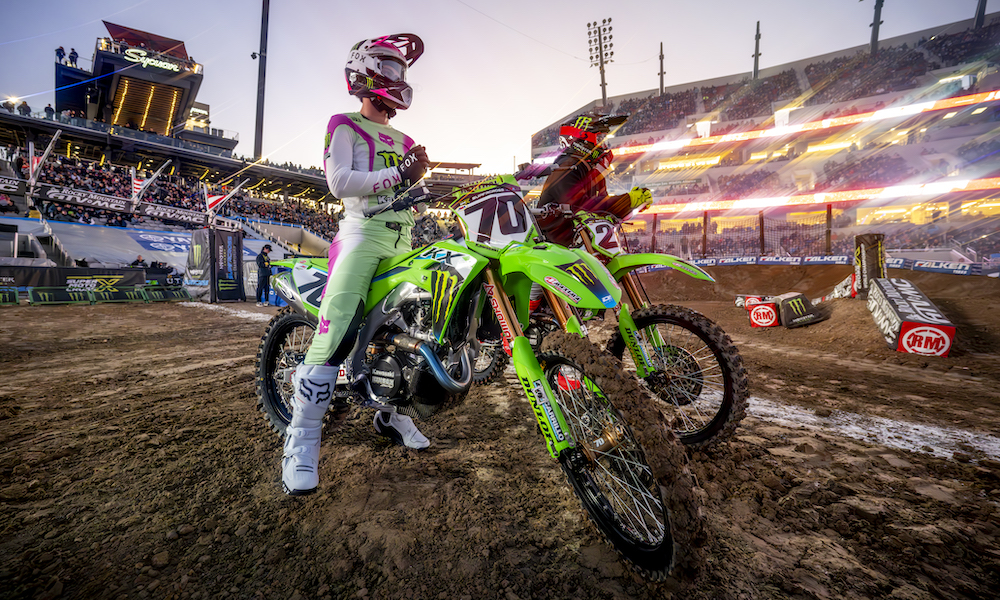 Two motocross riders racing supercross