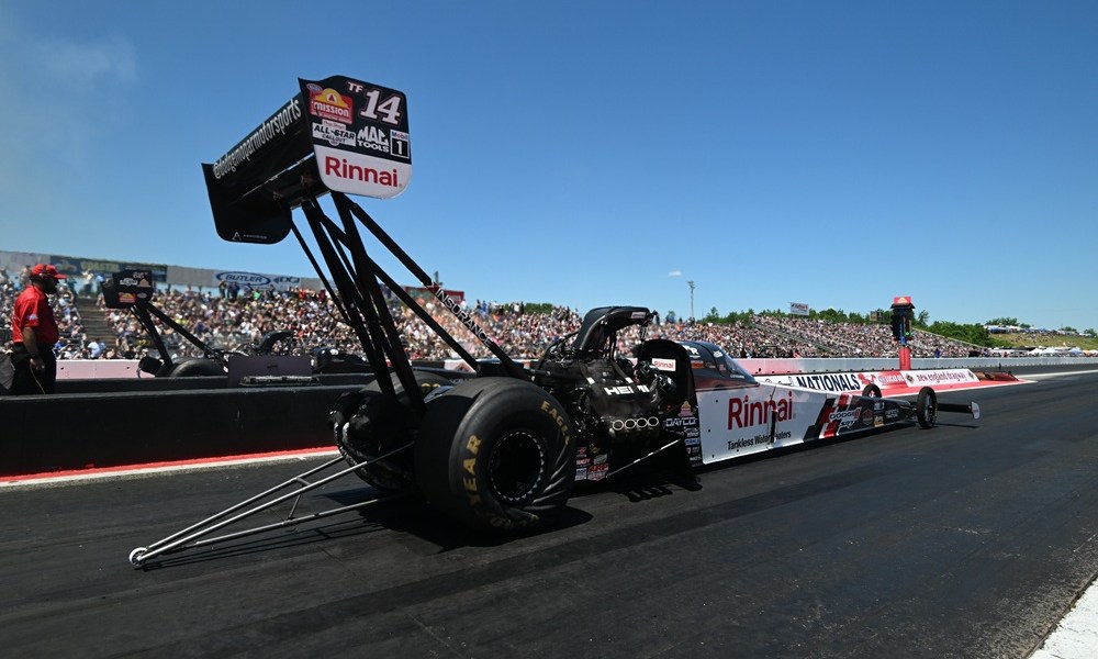 Drag racer speeding down track