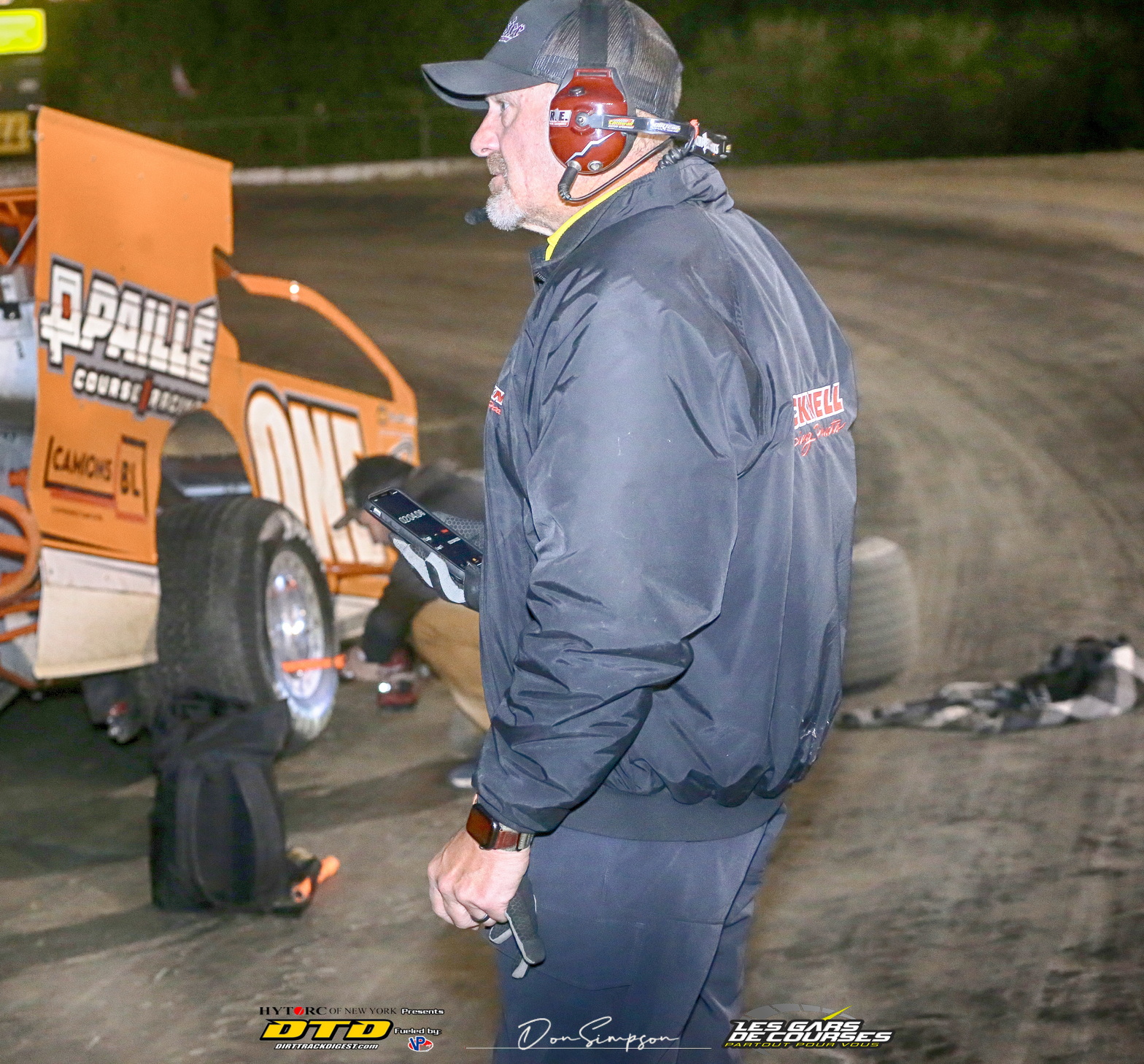 Race driver wearing competition jacket