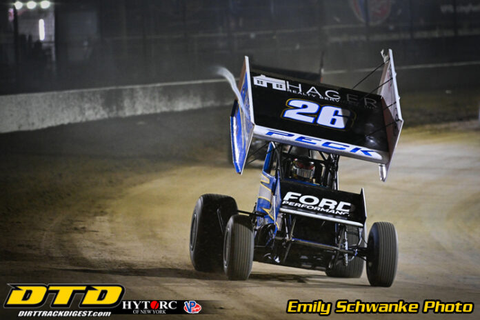 Sprint car slides through dirt corner