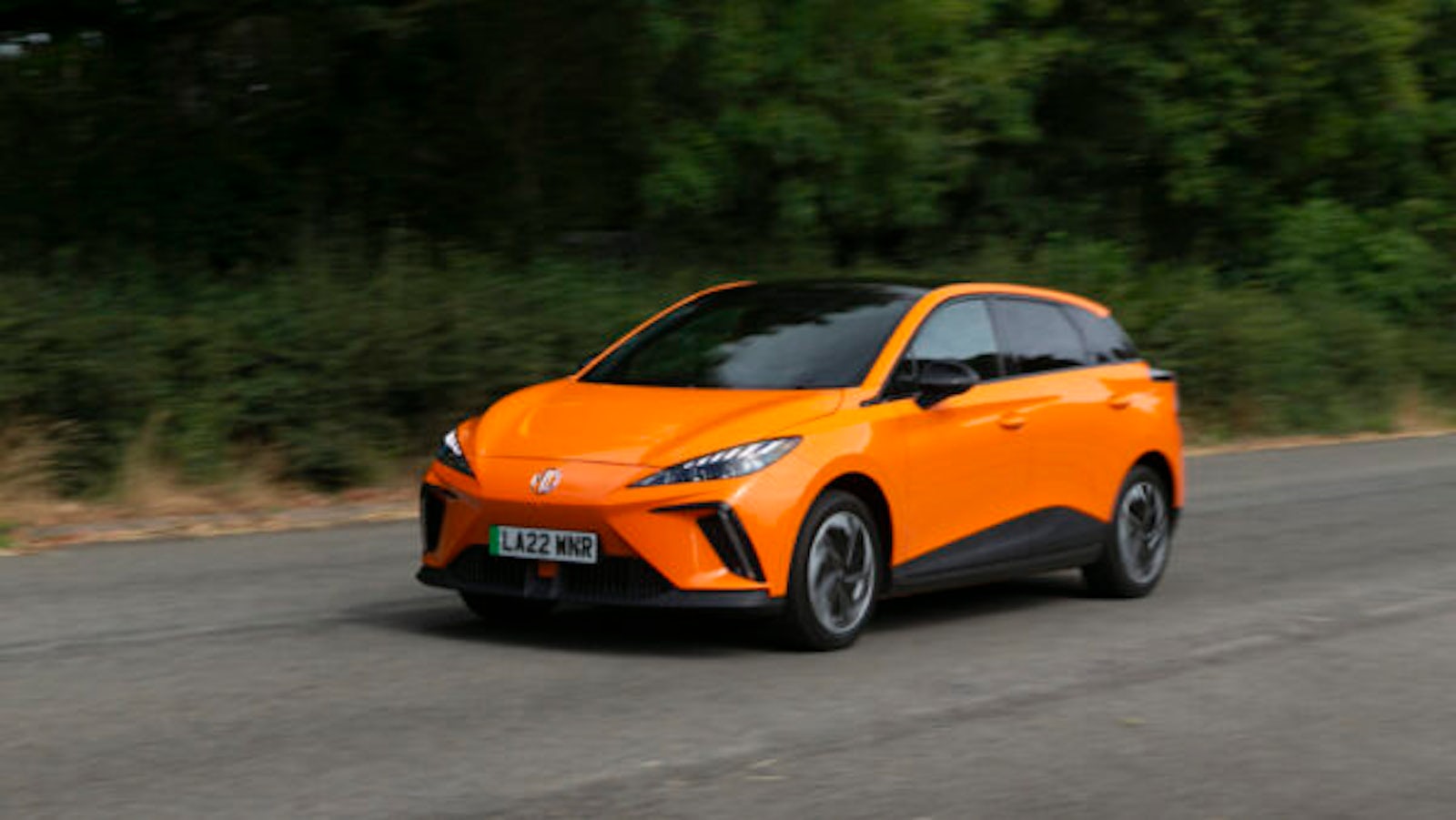 Orange MG4 EV on road