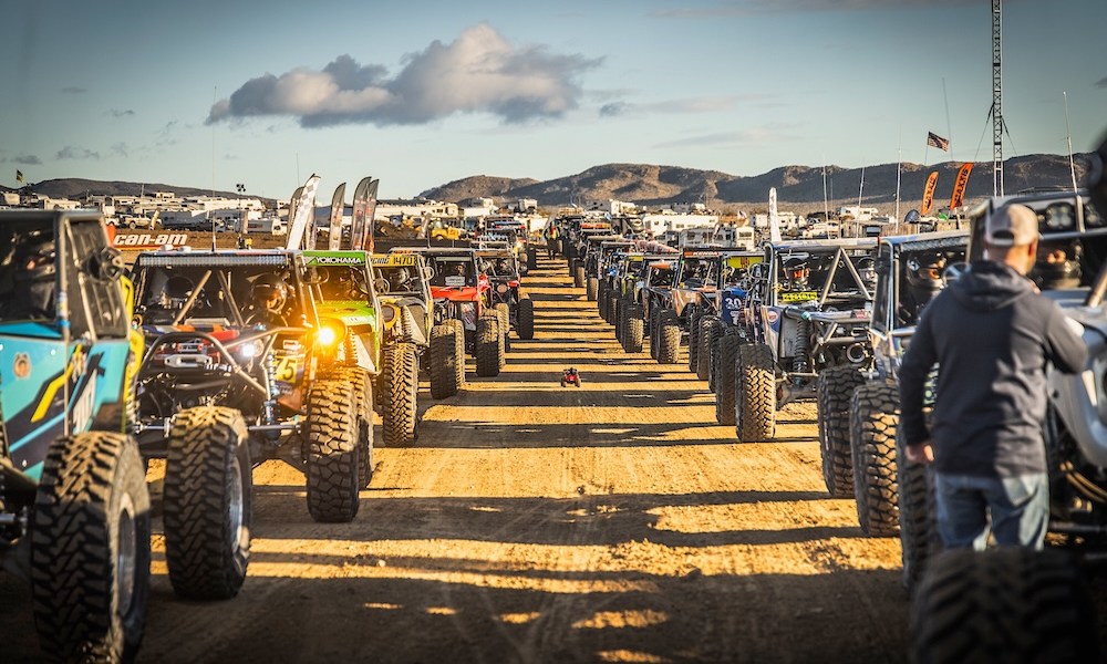 Racing trucks in desert terrain