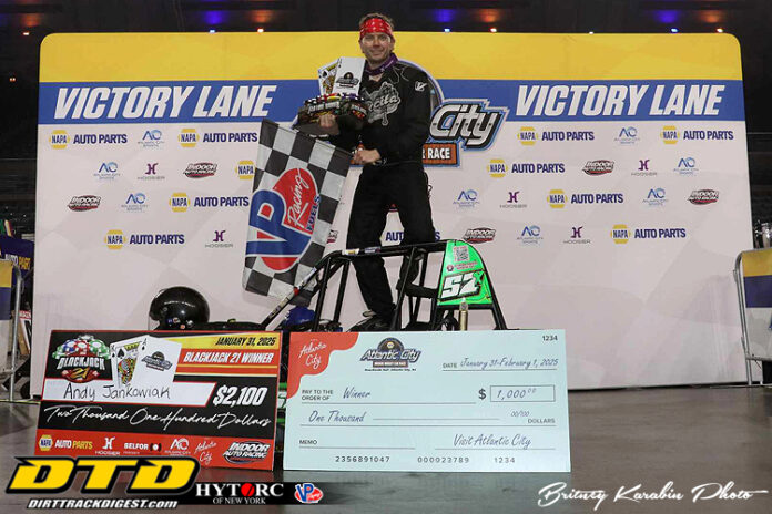 Man holding checkered race flag