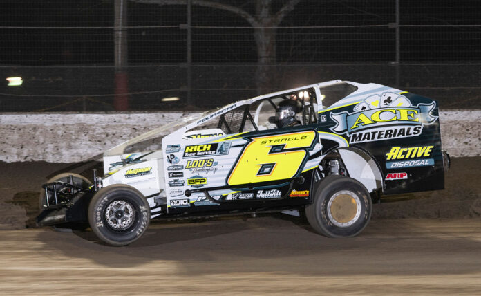 Dirt track race car in action