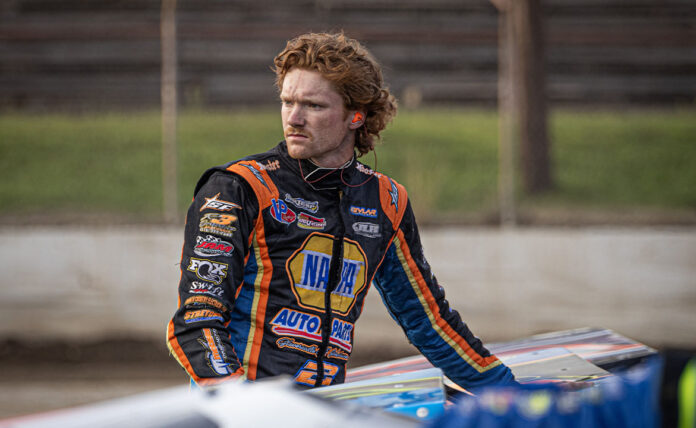 Two dirt track racers competing