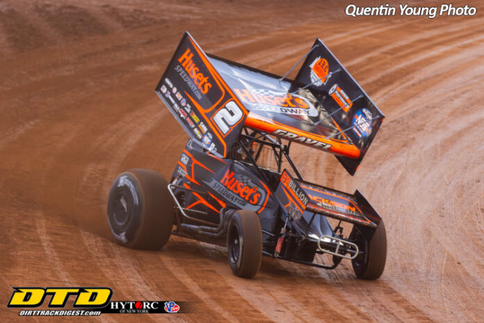 Sprint cars racing on dirt track