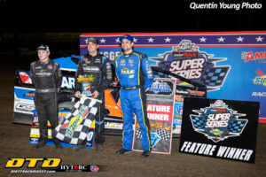 Race drivers celebrate with checkered flag