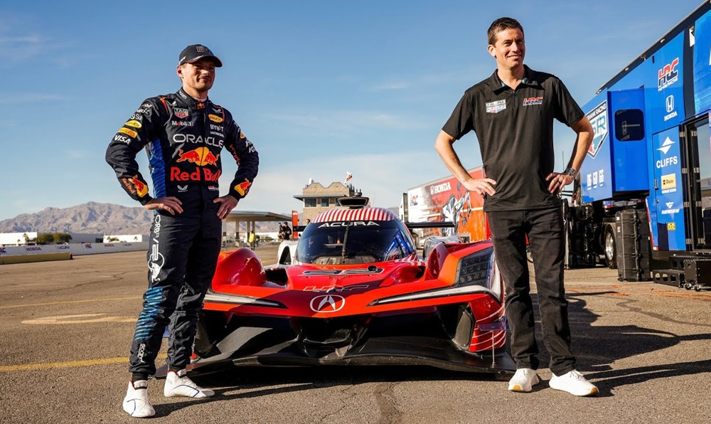 Two drivers beside racing car