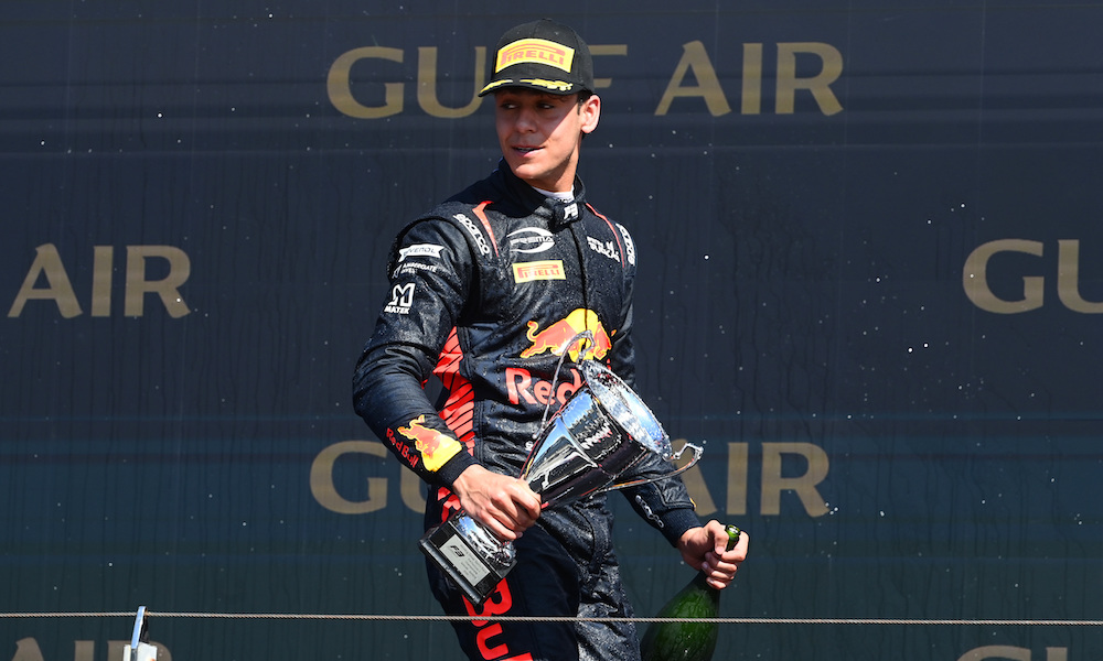 F1 driver celebrates podium with trophy