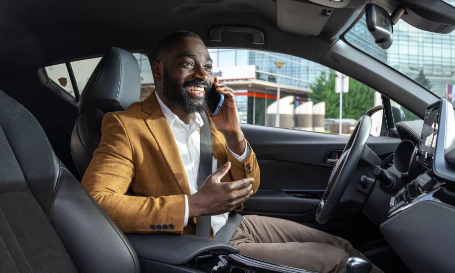 Professional driver seated in car