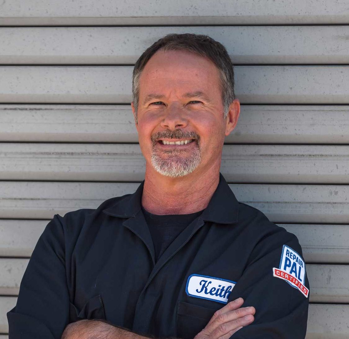 Professional headshot of smiling man