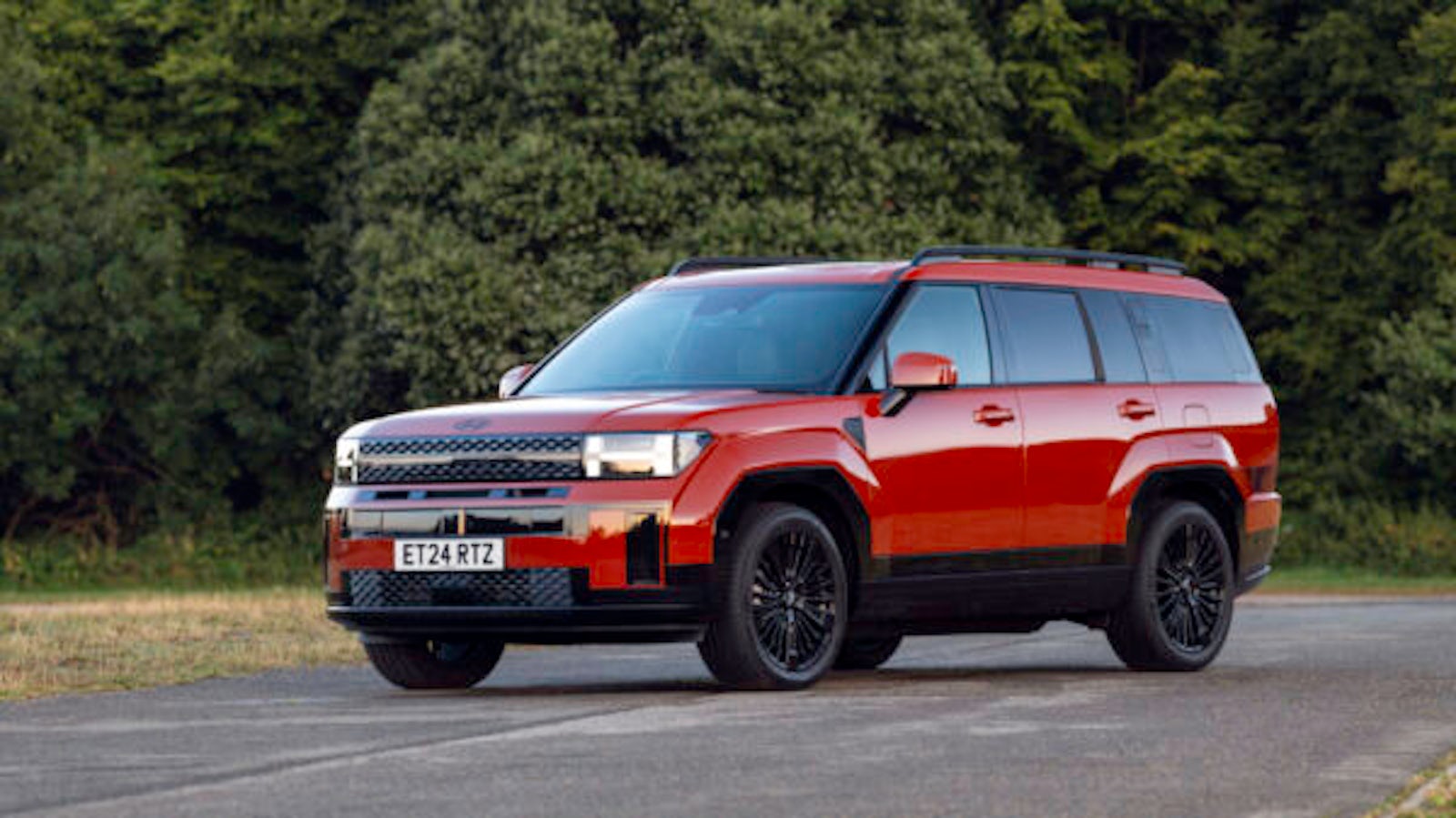 Red Hyundai Santa Fe SUV parked