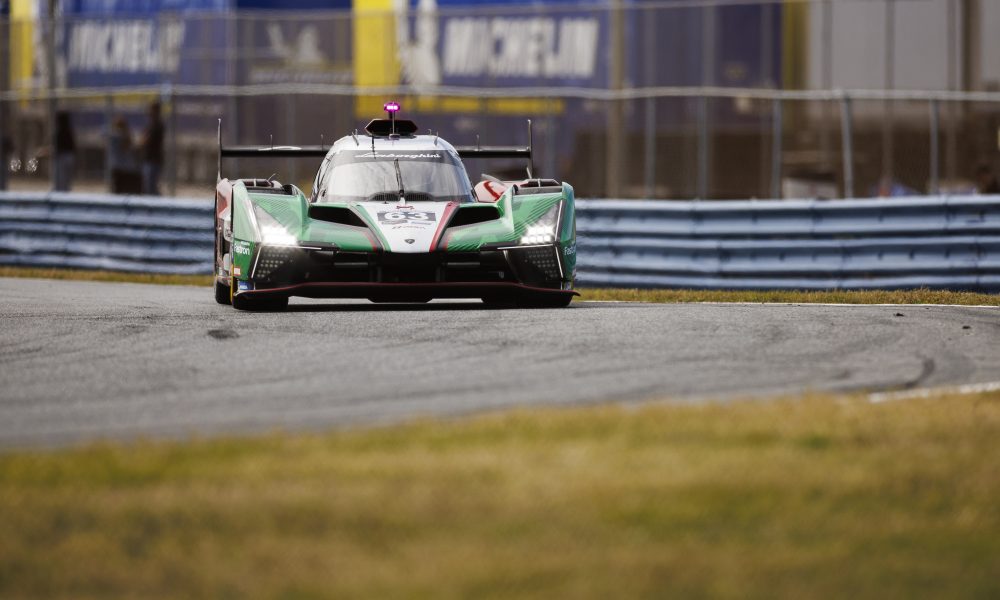 Green IndyCar on racetrack