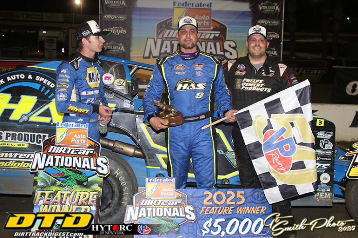 Racers celebrating with checkered flag