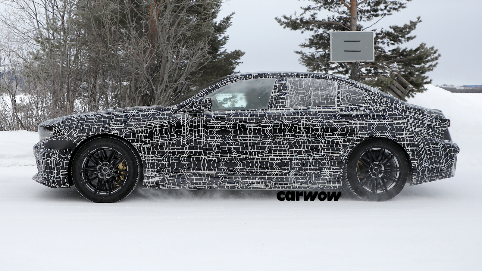 BMW M5 side view in snow