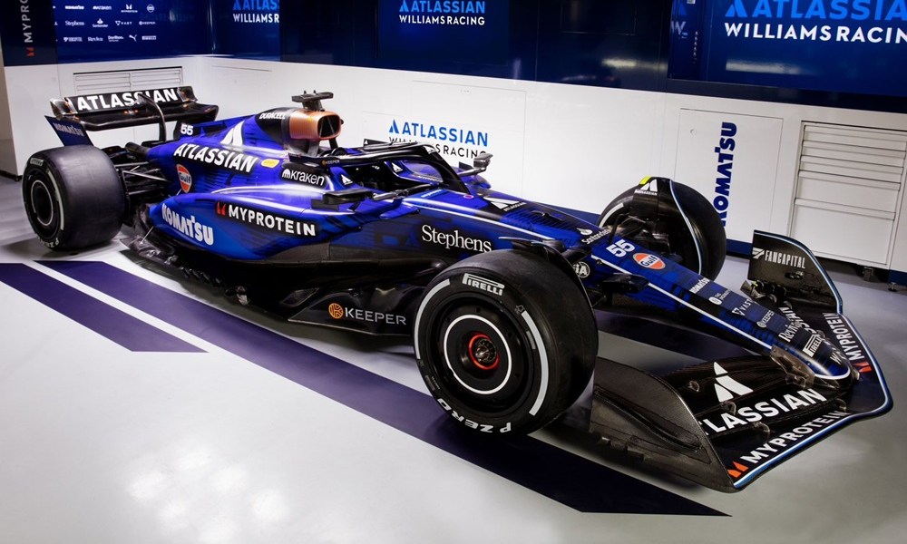 Blue race car in pit garage