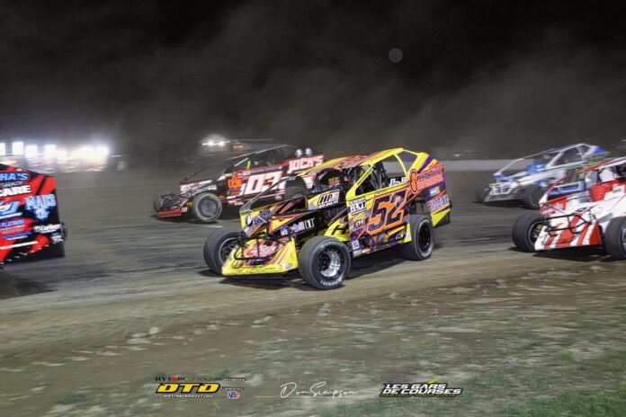 Yellow race car on dirt track