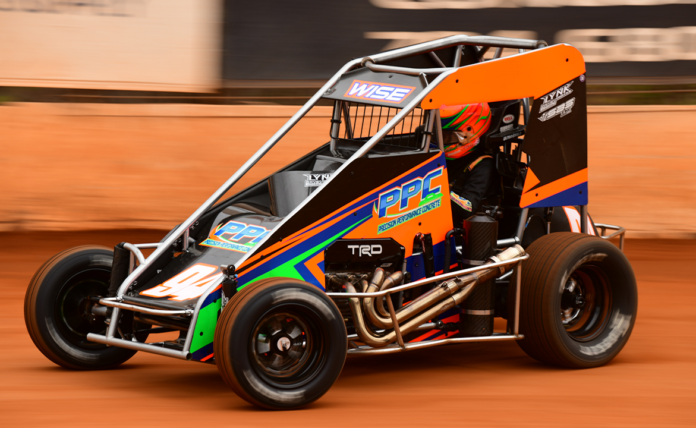 Race car sliding on dirt track