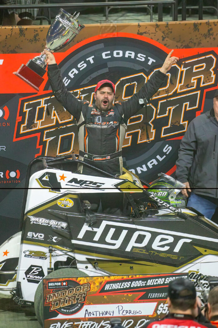 Man holds racing trophy