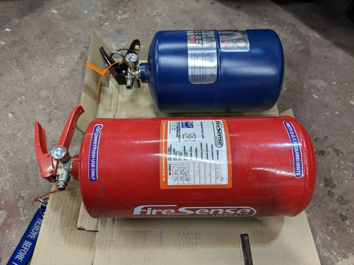 Race car fire extinguisher system