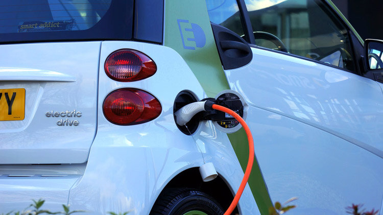 Electric car charging at station