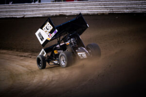 Black sprint car racing dirt track