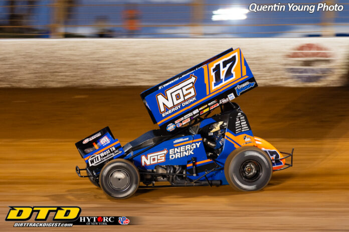 Sprint car racing on dirt track