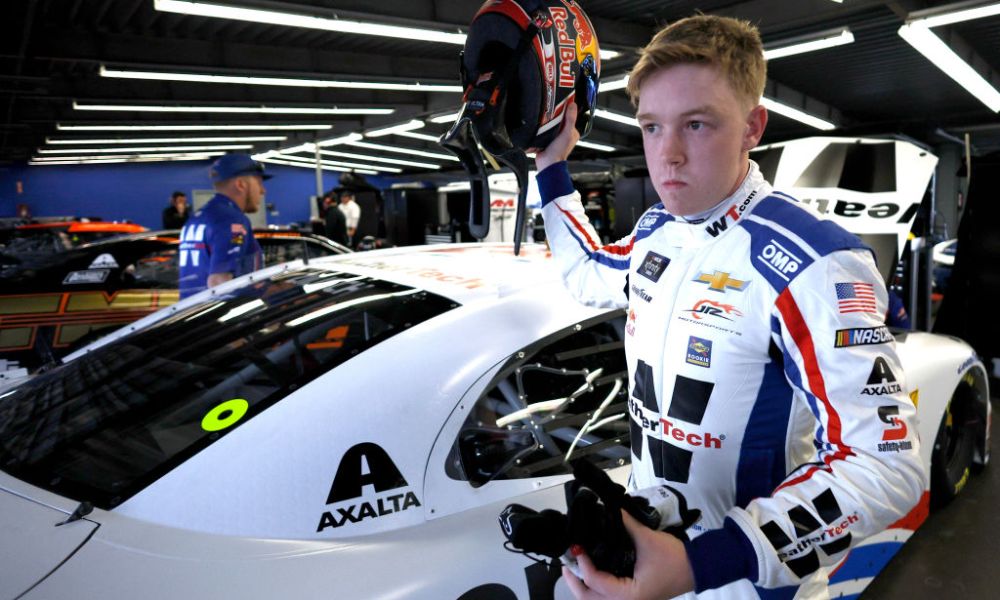 Race driver in white racing suit