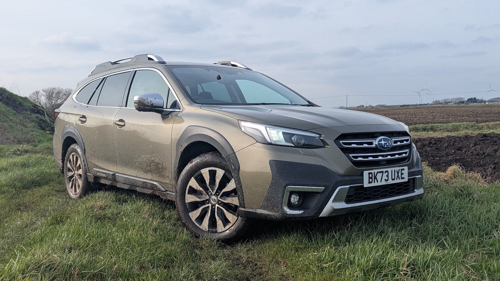 Subaru Outback parked in field