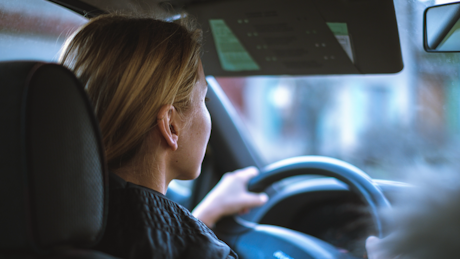 Woman at wheel of modern car