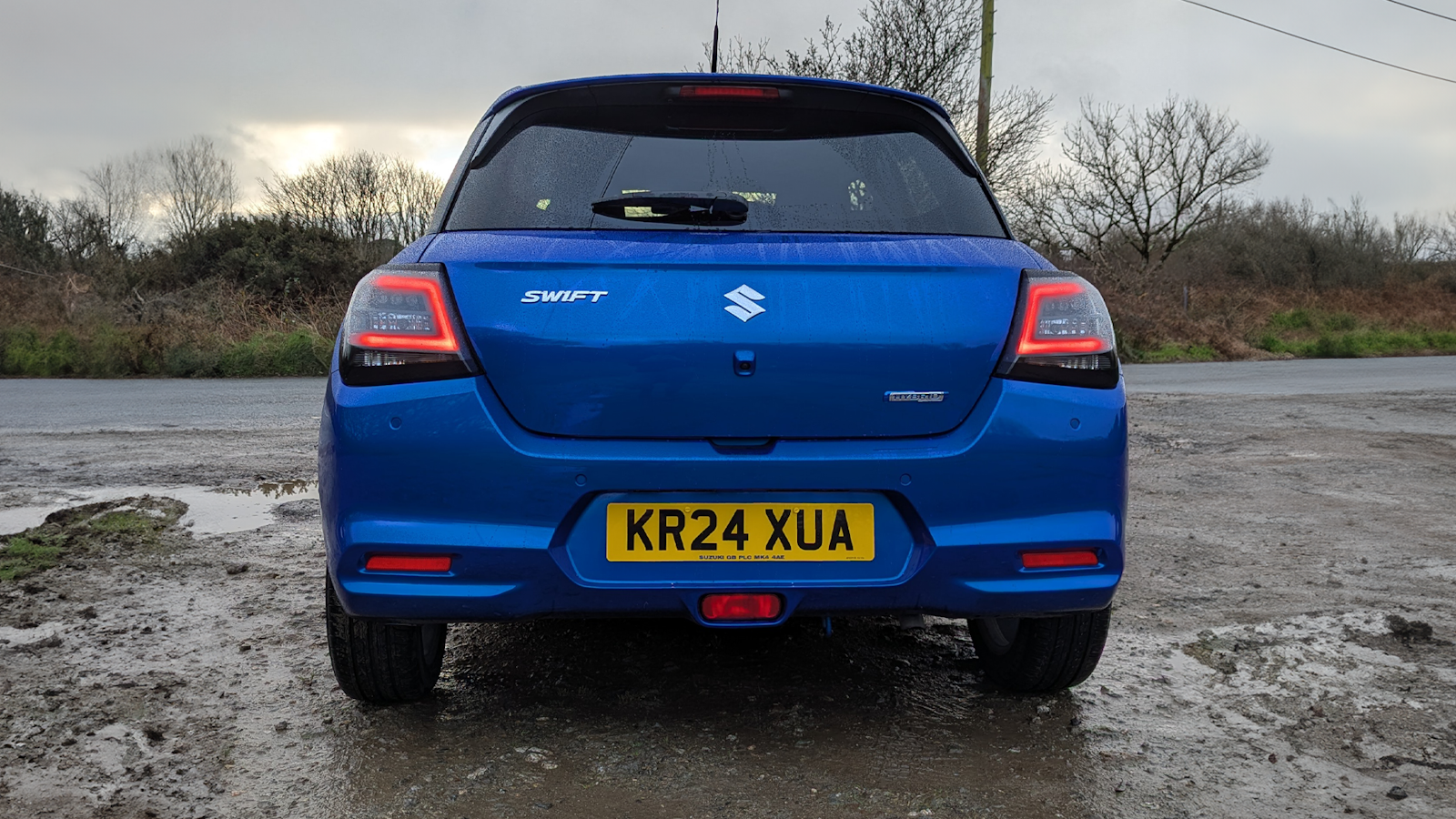 Blue Suzuki Swift 2024 rear view