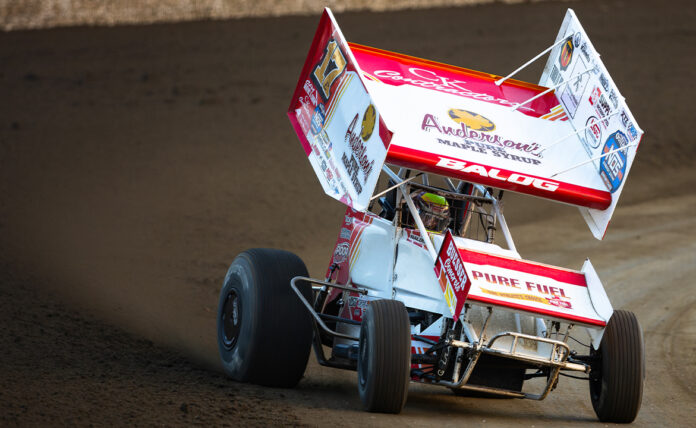 Sprint car racing on dirt track