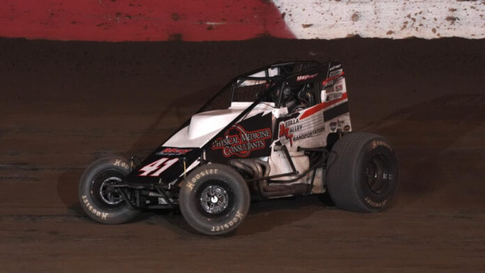 Sprint car racing on dirt track