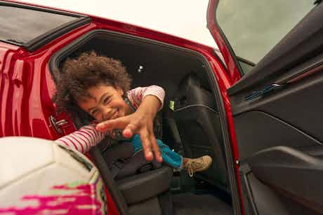 Girl in red car