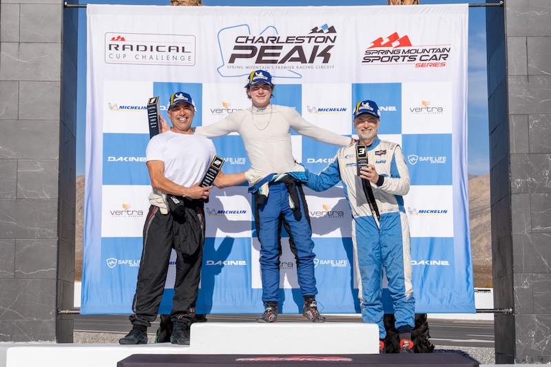 Three winners celebrate on podium