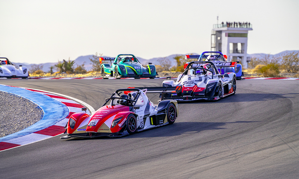 Race cars competing on racetrack