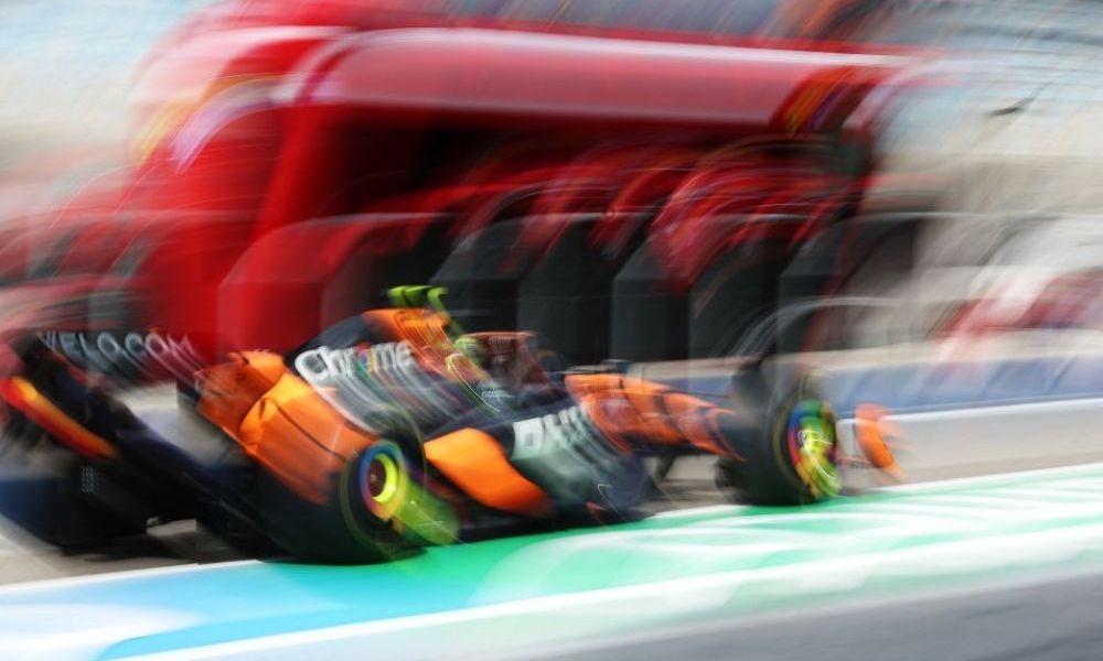 Blurred F1 car racing at speed