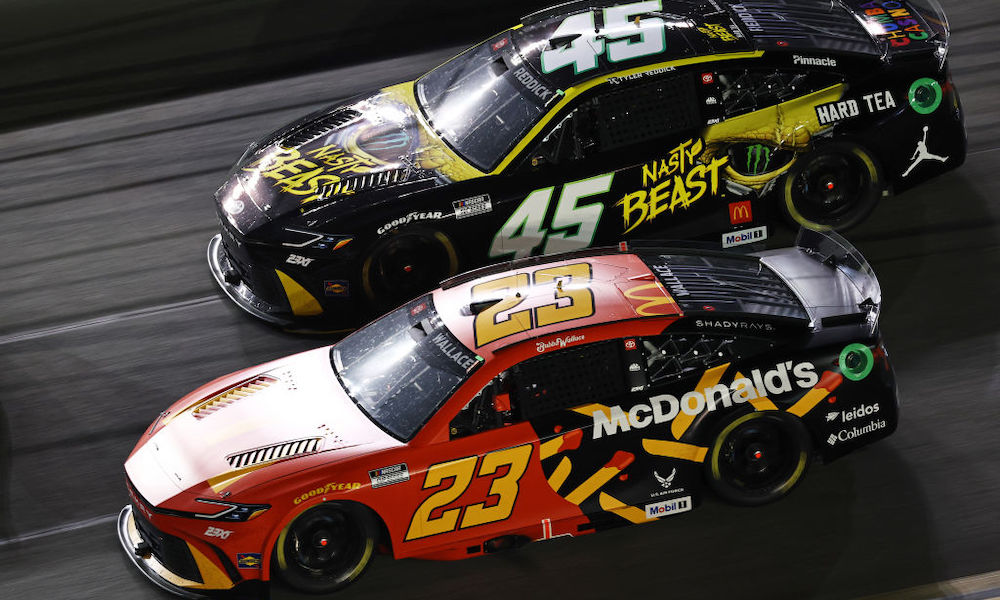 NASCAR cars racing side-by-side