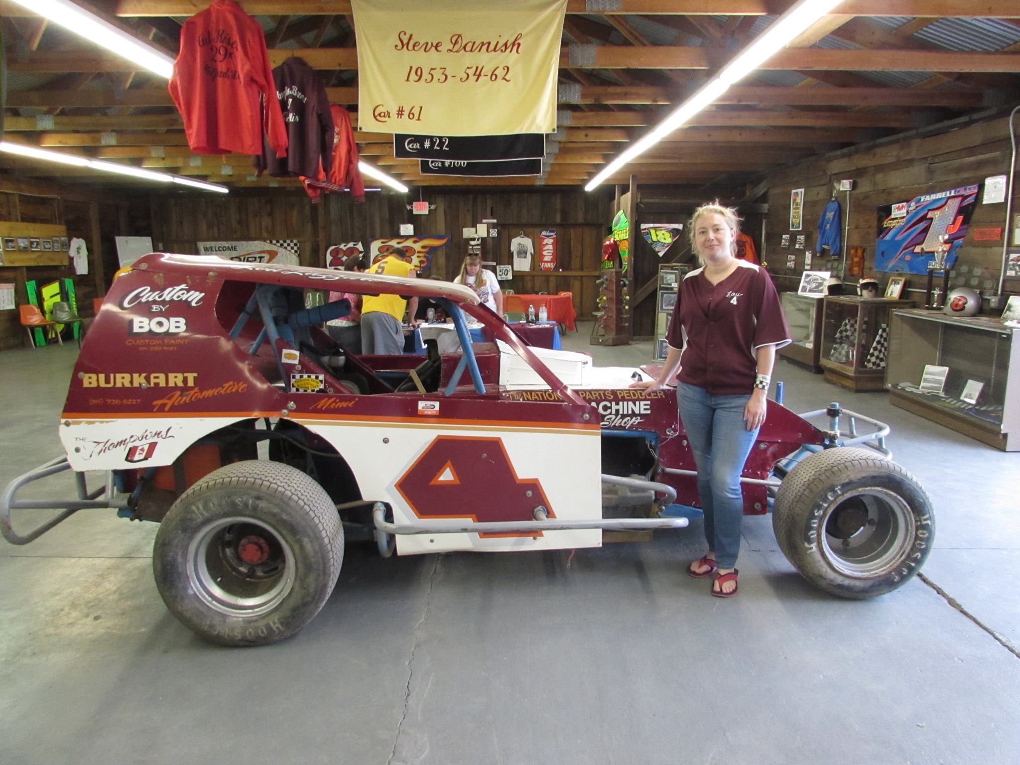 Racing driver Mimi smiling at camera